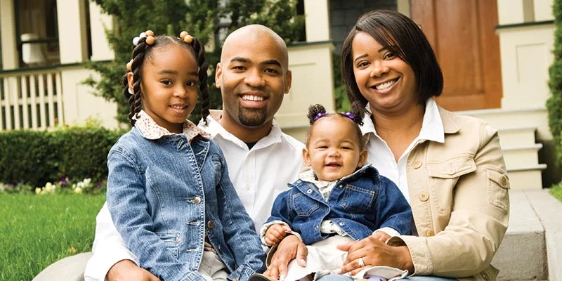 Family On House Steps | Aumsbaugh Flooring | Columbia City, IN